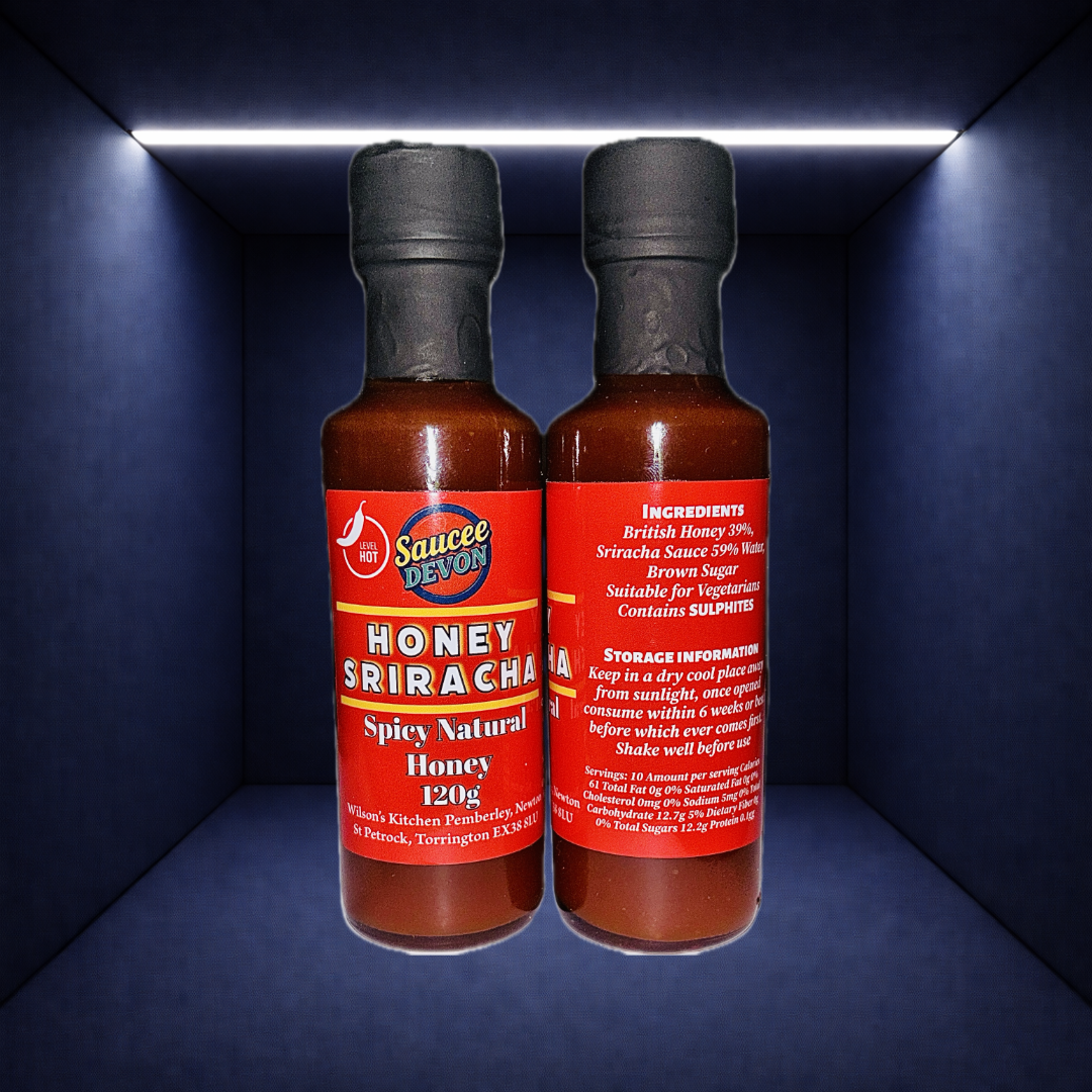Wilson’s Kitchen Honey Sriracha Sauce bottle with label showing chili peppers and honey, ready for cooking or dipping.