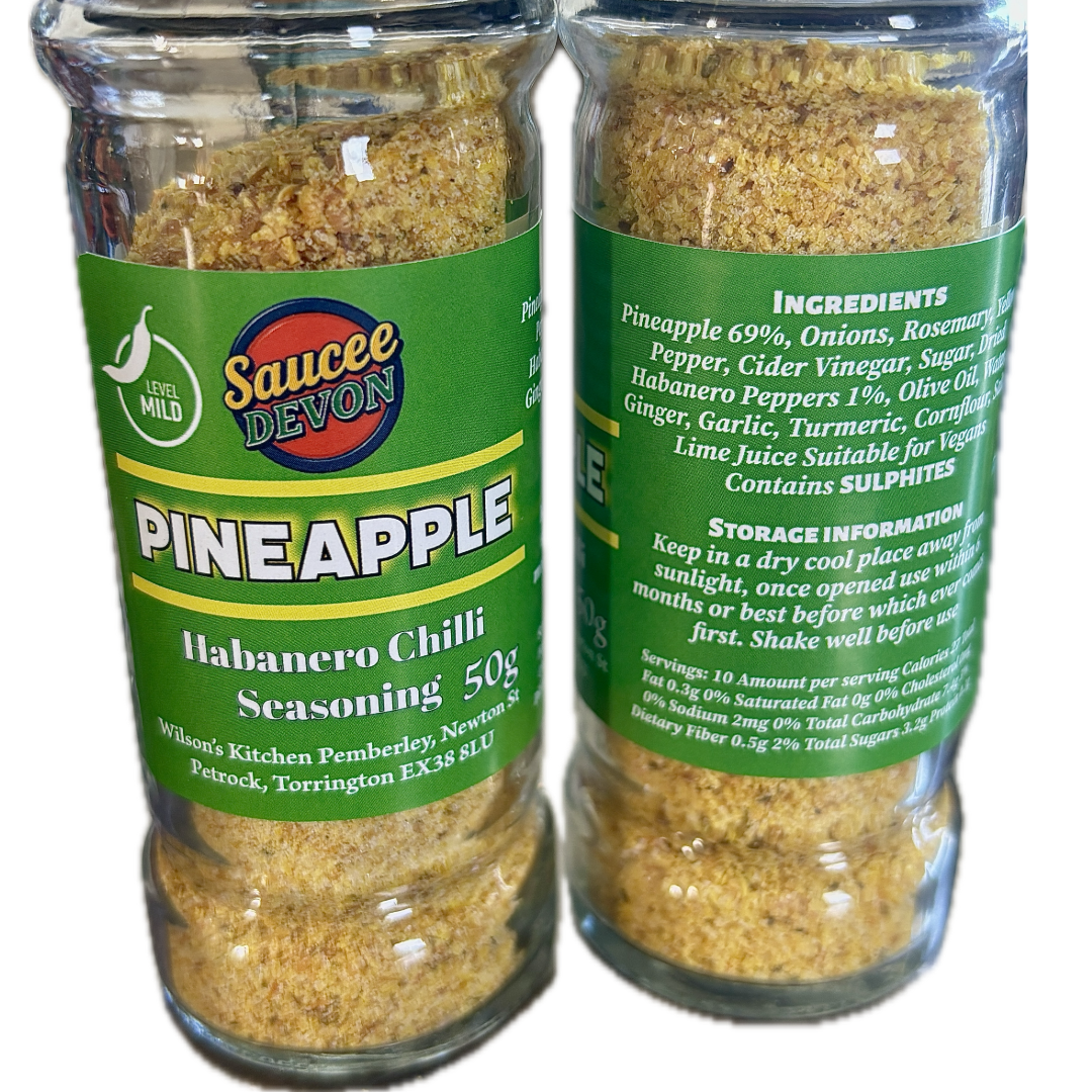 Wilson’s Kitchen Pineapple Habanero Chilli Seasoning in a jar, vibrant orange pineapple and red habanero peppers, artisan chilli sauce.
