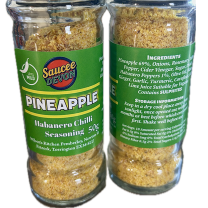 Wilson’s Kitchen Pineapple Habanero Chilli Seasoning in a jar, vibrant orange pineapple and red habanero peppers, artisan chilli sauce.