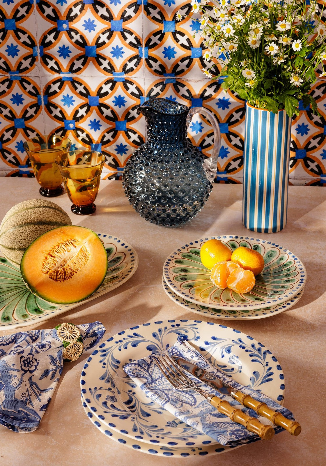Blue and orange striped ceramic Amalfi Coast Vase by Casa, perfect for tabletop decor and centerpieces.