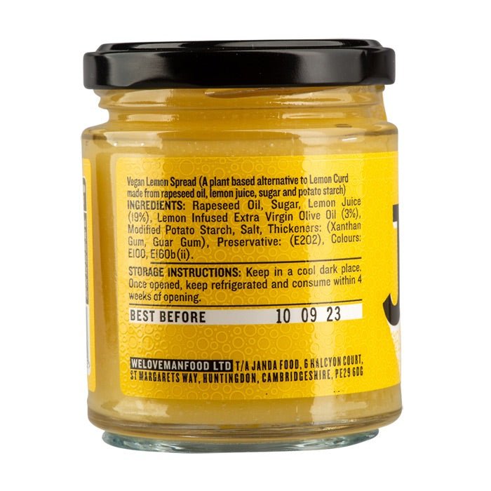 Janda vegan lemon spread in a jar, showcasing its bright yellow color and smooth texture on a white background.