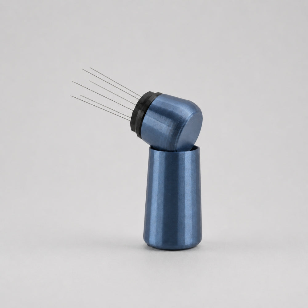 KNOCDIC® metallic blue espresso WDT tool with standing holder for precise coffee grounds distribution.