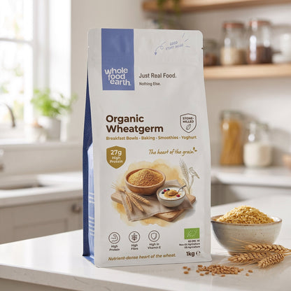 Organic Whole Food Earth wheatgerm in a jar with a spoon, showing fresh, natural wheatgerm for healthy cooking and baking.