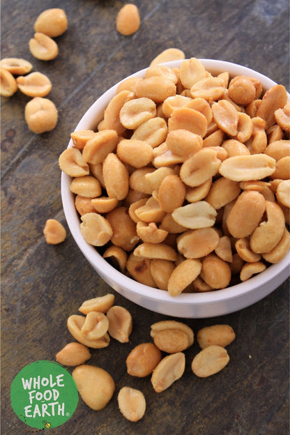 Baked unsalted peanuts by Whole Food Earth, GMO-free, vegan-friendly nuts and seeds snack in a bowl.