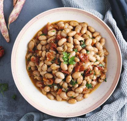 Whole Food Earth Borlotti Beans, GMO-free, natural, vegan pulses in a bowl, showcasing their plump, beige and red mottled appearance.