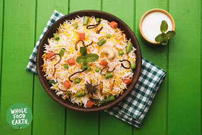 Whole Food Earth brown Basmati rice in a clear bag, GMO-free, natural, vegan, dairy-free, no added sugar, traditional rice product.