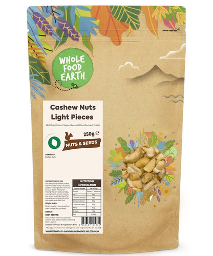 Light pieces of Whole Food Earth cashew nuts, GMO-free, showcasing fresh, natural nut segments on a white background.