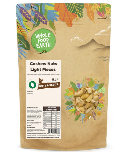 Light pieces of Whole Food Earth cashew nuts, GMO-free, showcasing fresh, crunchy, and natural nuts in a natural setting