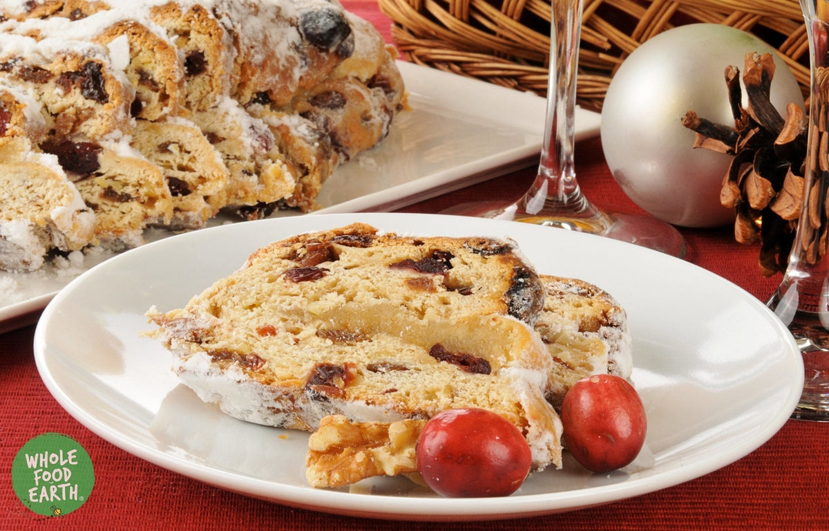 Dried cranberries infused in apple juice, Whole Food Earth brand, sliced with vibrant red color and natural dried fruit texture.
