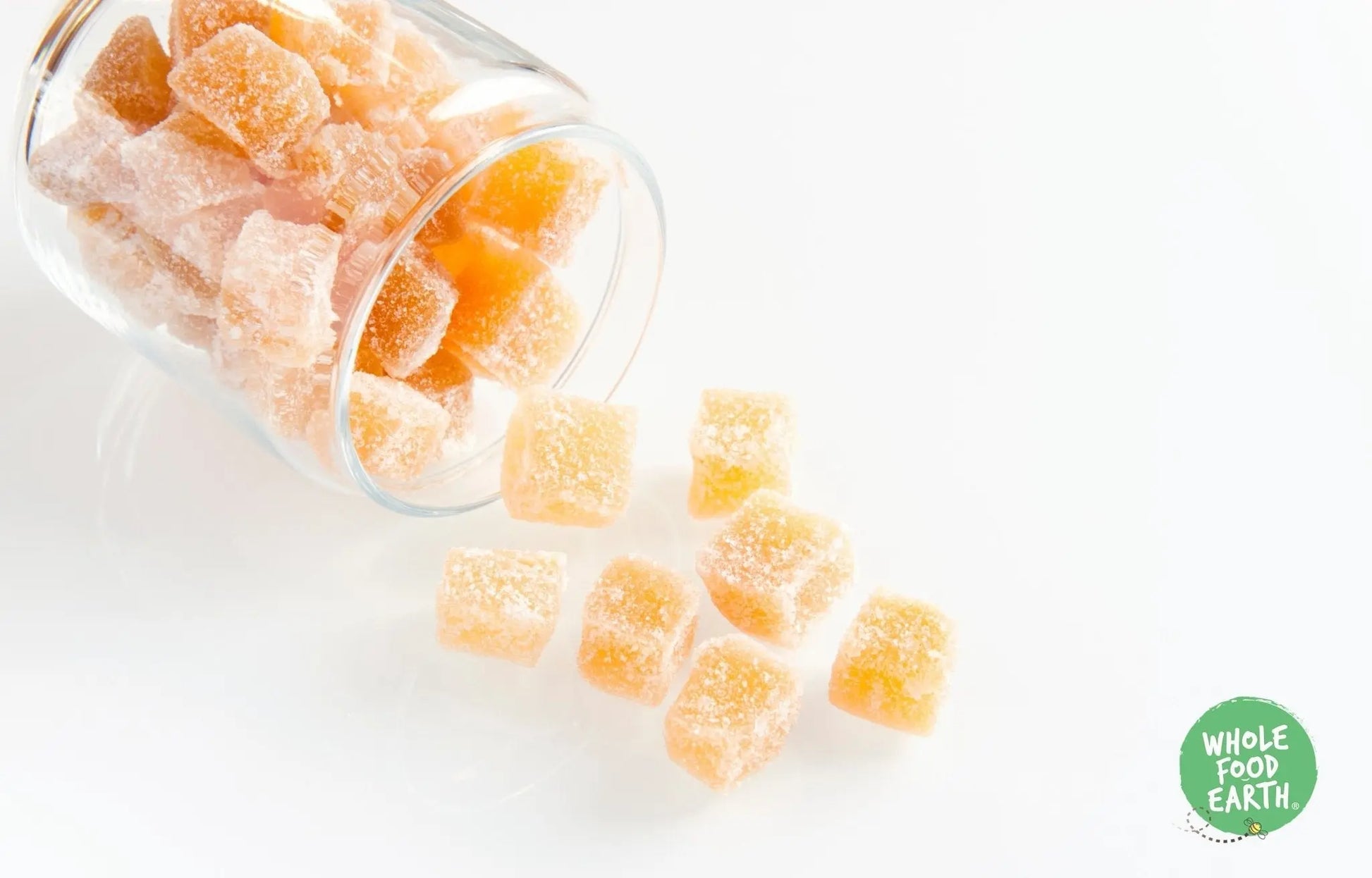 Crystallized ginger by Whole Food Earth, GMO-free, vegan, and dairy-free, showing golden ginger pieces coated in sugar.
