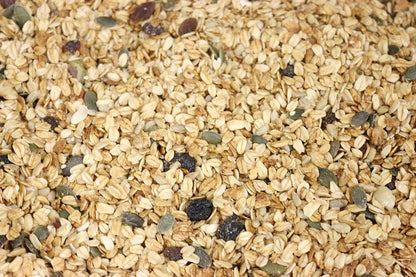 Whole Food Earth Deluxe Muesli cereal with flakes, dried fruit, nuts, and seeds in a vegan, dairy-free, no-added-sugar blend.