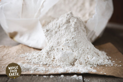 Raw feed grade diatomaceous earth mineral from Whole Food Earth, showing the unrefined, powdery white natural mineral for animal feed.