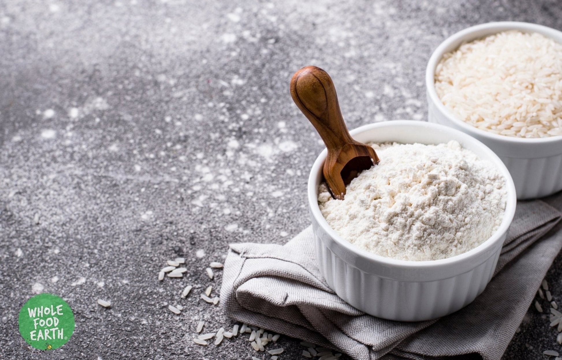 Ground rice flour from Whole Food Earth, GMO-free, vegan, dairy-free, with no added sugar, shown in a bowl with grains.