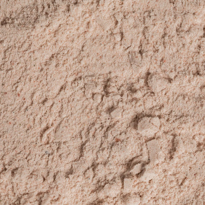 Fine black salt, Kala Namak, from Whole Food Earth, unrefined and additive-free, shown in a close-up view.