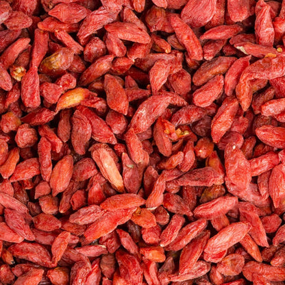 Dried Goji Berries from Whole Food Earth, GMO-free raw sun-dried red berries, close-up of dried fruit on a white background.