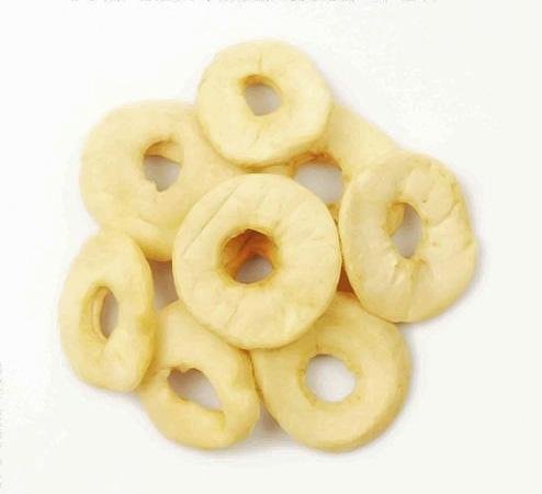 Organic dried apple rings from Whole Food Earth, showing a close-up of golden apple slices with a natural, textured surface.