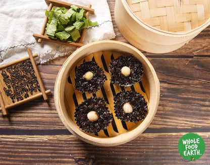 Organic black glutinous rice from Whole Food Earth, raw and GMO-free, shown in a close-up view.