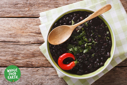 Organic Black Turtle Beans from Whole Food Earth, raw and GMO-free, shown in a close-up image of the beans in a bowl.