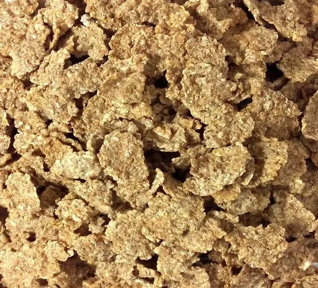 Whole Food Earth Organic Bran Flakes cereal in a bowl, showing crispy, golden flakes with no added sugar or GMOs.