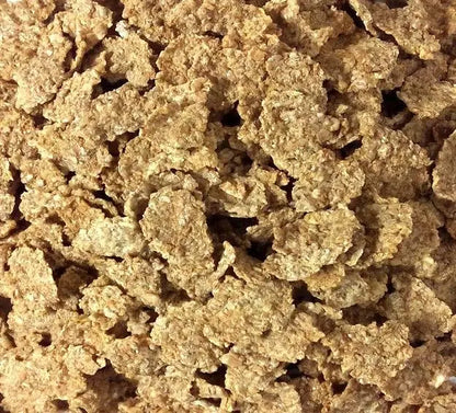 Whole Food Earth Organic Bran Flakes cereal in a bowl, showing crispy, golden flakes with no added sugar or GMOs.
