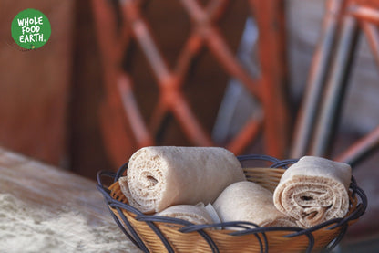 Organic Brown Teff Flour from Whole Food Earth, raw, GMO-free, vegan, and low-GI, shown in a clear natural setting.