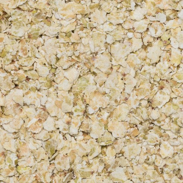 Raw organic buckwheat flakes cereal by Whole Food Earth, showing light brown, toasted buckwheat grains in a close-up shot.