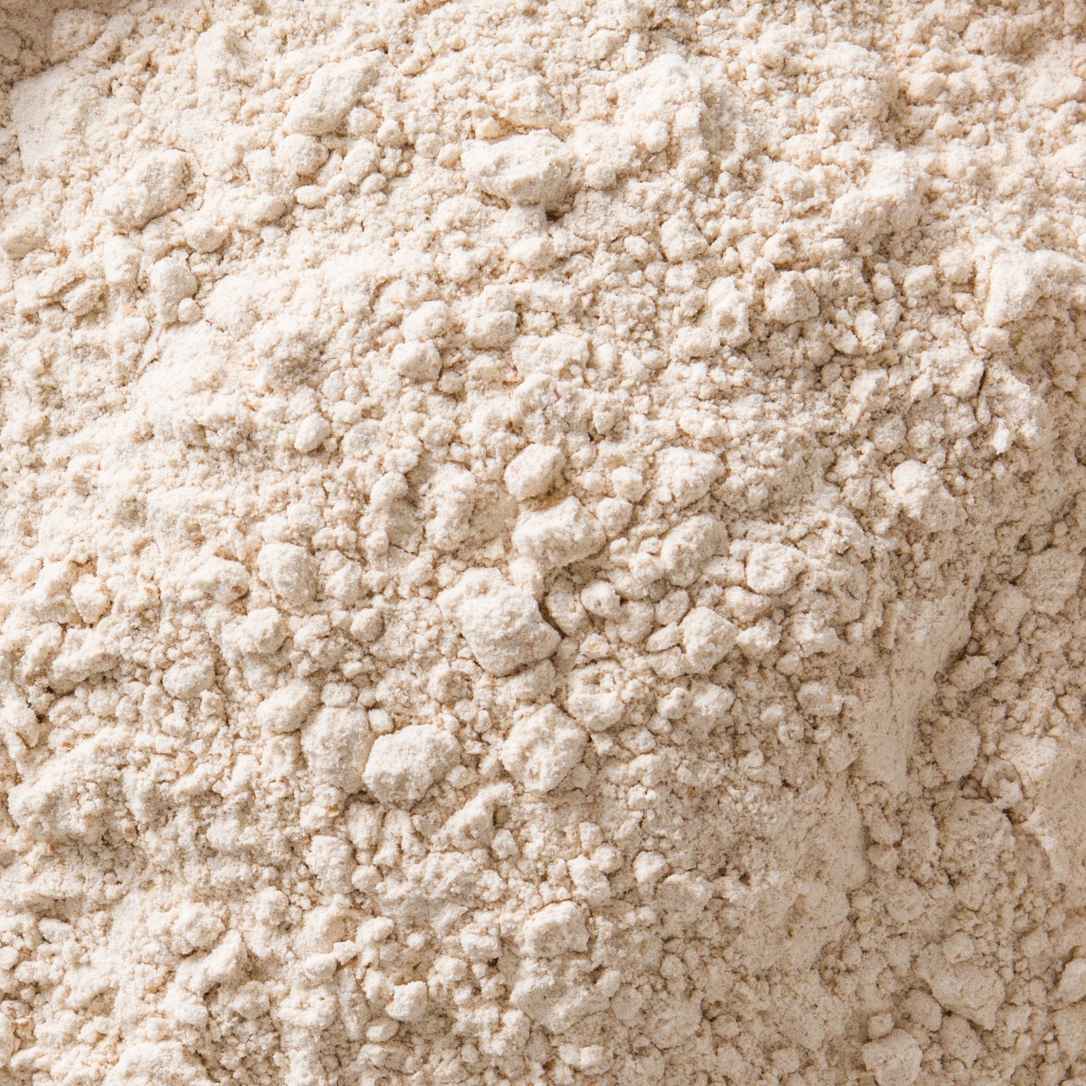 Organic chickpea flour from Whole Food Earth in a clear bag, showcasing light beige, finely ground gram flour for baking and cooking.