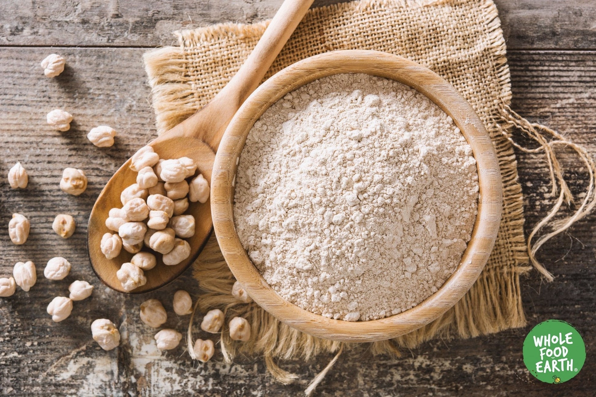 Organic chickpea flour from Whole Food Earth, shown in a bag, labeled as vegan, GMO-free, and suitable for baking and cooking.