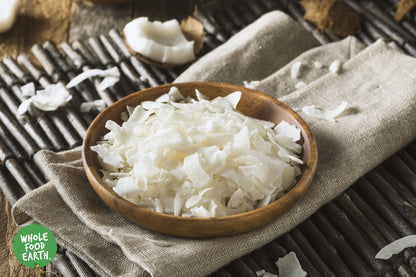 Organic dried coconut chips from Whole Food Earth, raw and GMO-free, showing golden toasted coconut slices on a neutral background.