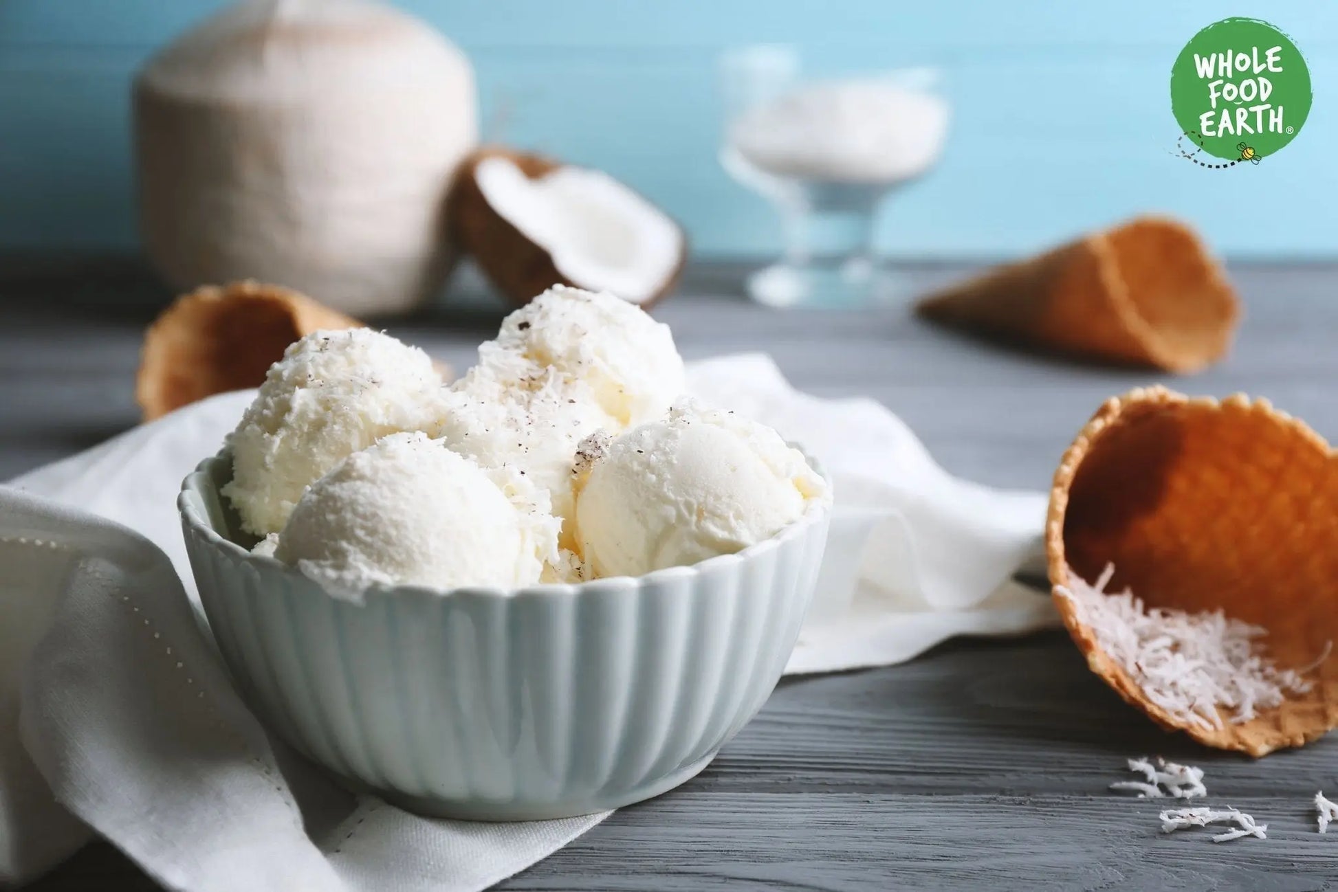 Organic desiccated coconut from Whole Food Earth, showing shredded, dried coconut flakes in a close-up view.