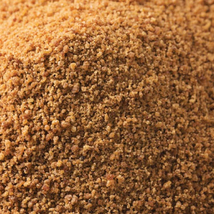 Organic coconut sugar from Whole Food Earth, natural sweetener with a bag of granulated coconut sugar on a wooden surface.