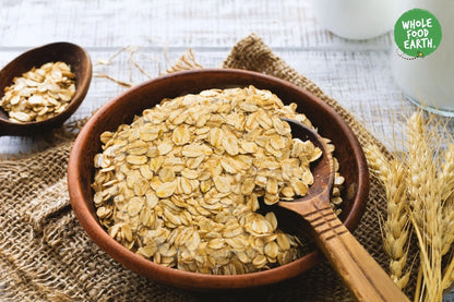 Organic gluten-free jumbo oats from Whole Food Earth, showing a bowl of hearty oats with a rustic background.