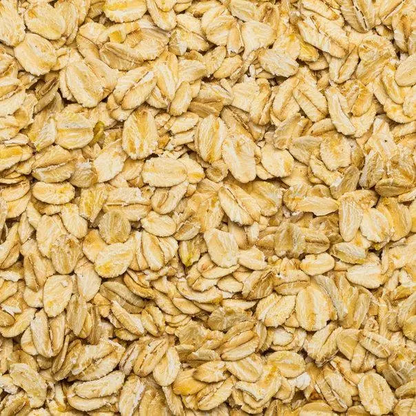 Organic gluten-free jumbo oats cereal by Whole Food Earth, showing a bowl of oats with a spoon and fresh ingredients.