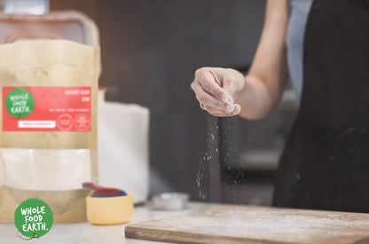 Organic Guar Gum by Whole Food Earth in a resealable bag, showing the powder texture and label highlighting GMO-free and vegan qualities.