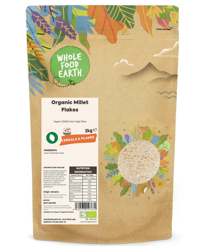 Organic millet flakes cereal by Whole Food Earth, close-up of golden millet flakes in a bowl on a white background.