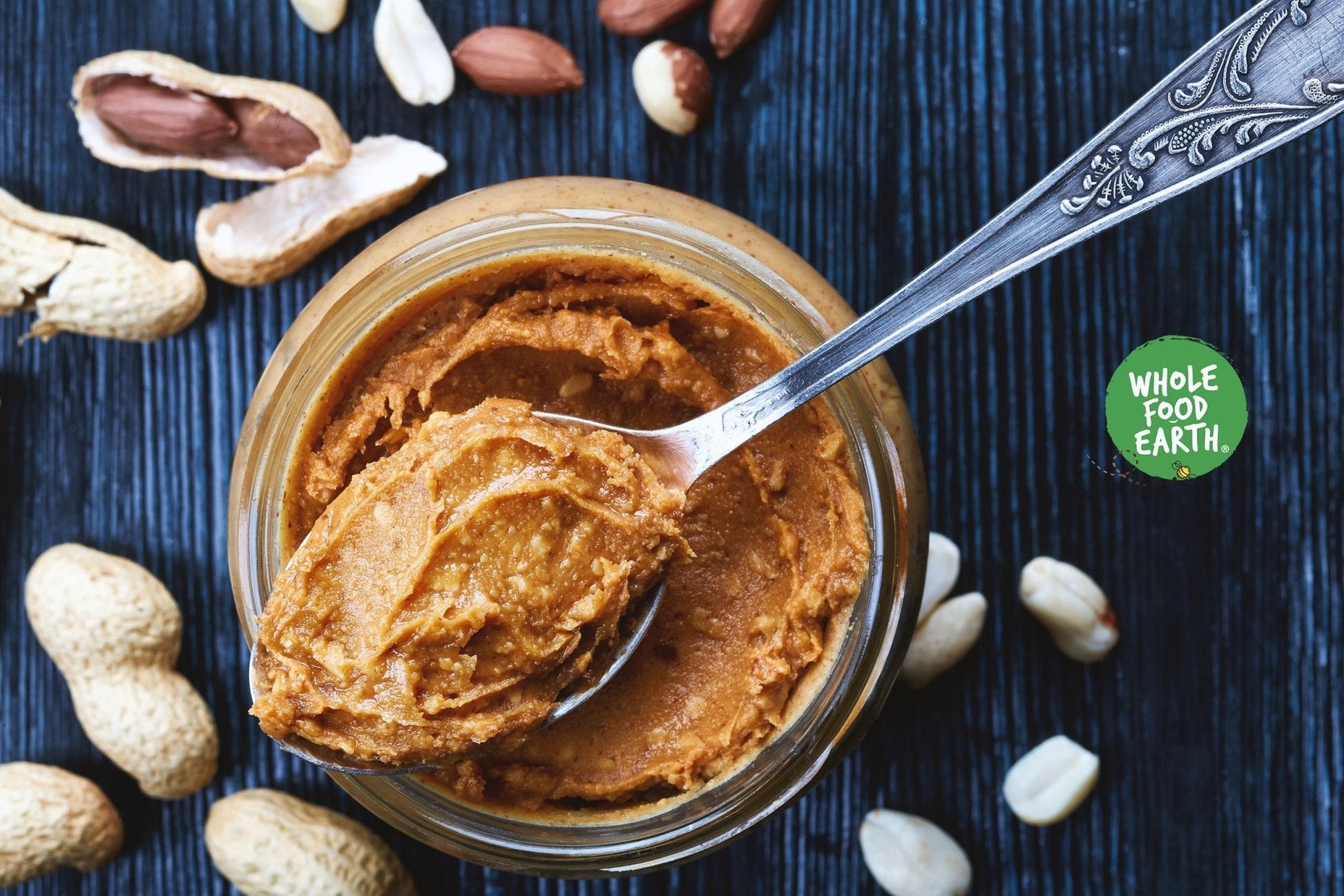 Raw organic Paleskin peanuts from Whole Food Earth, showcasing their natural, sun-dried appearance in a colorful bowl.