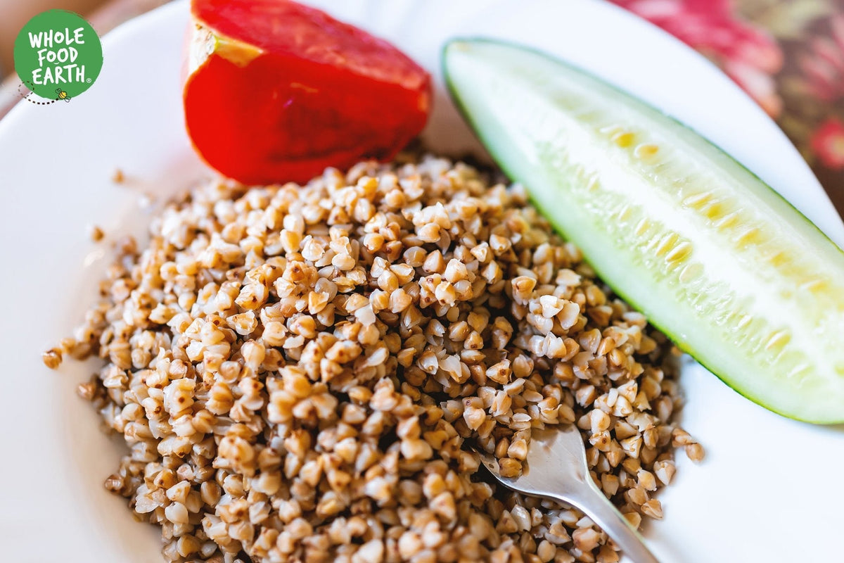 Organic roasted buckwheat grains from Whole Food Earth, showcasing the light brown, toasted cereal in a natural setting.