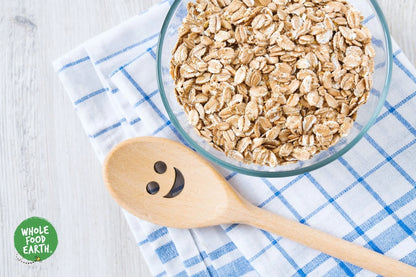 Organic spelt flakes cereal from Whole Food Earth, showing a bowl of crispy, GMO-free spelt flakes on a wooden table.