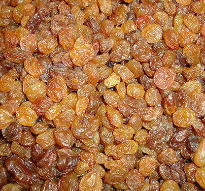 Organic Sultanas from Whole Food Earth, dried natural grapes, vegan and GMO-free, shown in a close-up image.