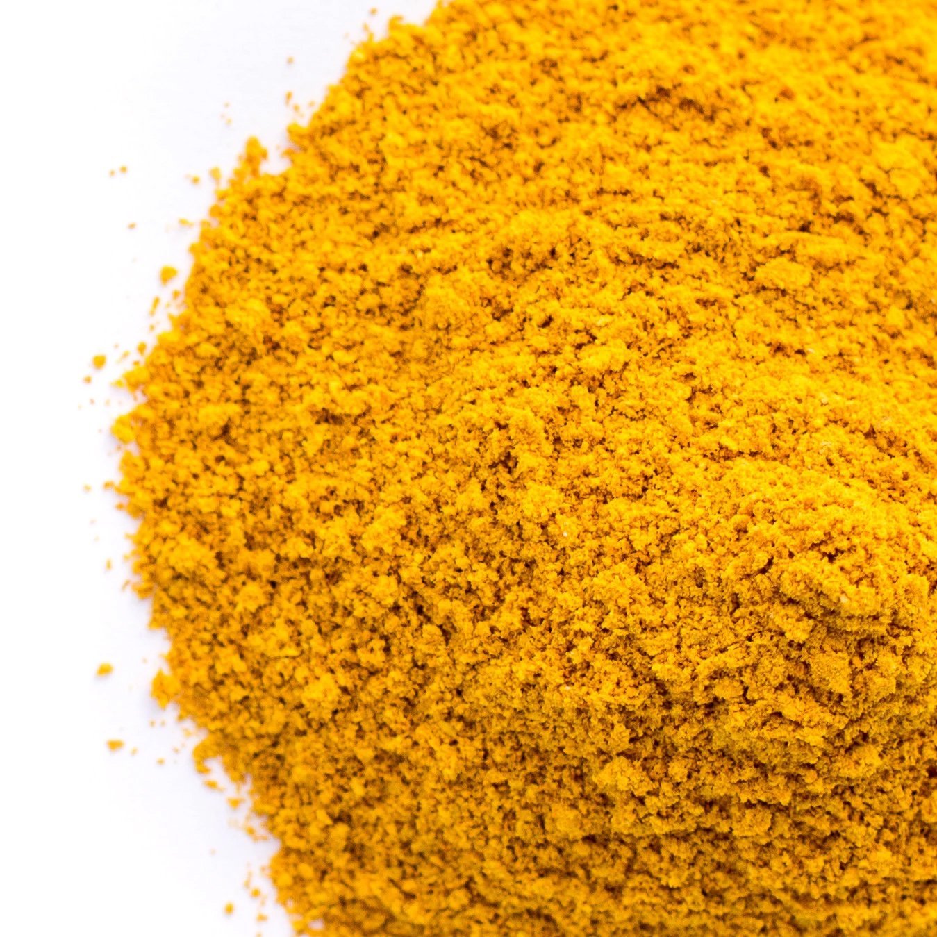 Organic turmeric powder from Whole Food Earth, vibrant yellow spice in a jar, rich in curcumin, vegan and GMO-free herbal spice.