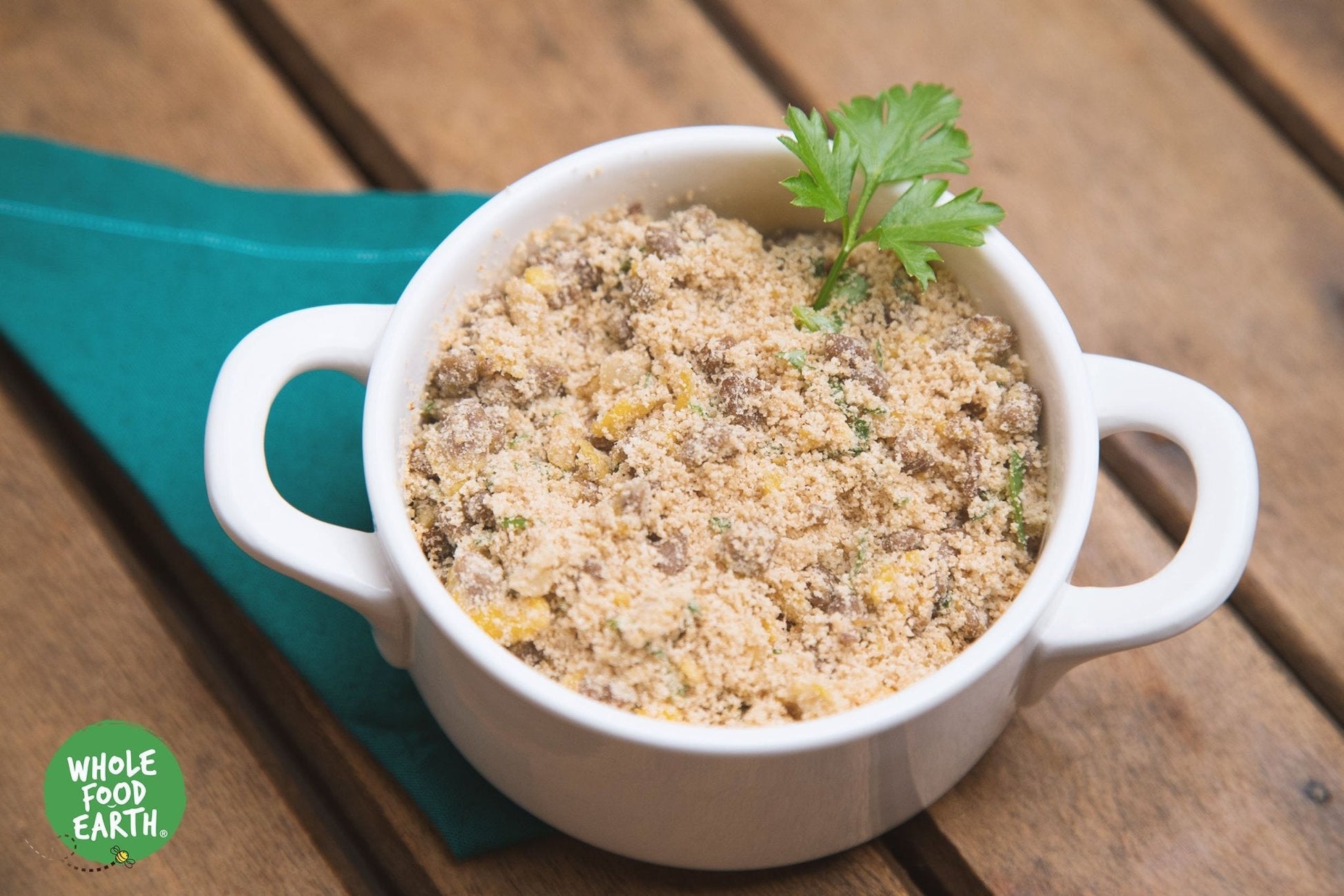 Organic White Cassava Flour from Whole Food Earth, gluten-free, vegan, GMO-free flour in a clear bag on a wooden surface.