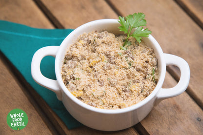 Organic White Cassava Flour from Whole Food Earth, gluten-free, vegan, GMO-free flour in a clear bag on a wooden surface.