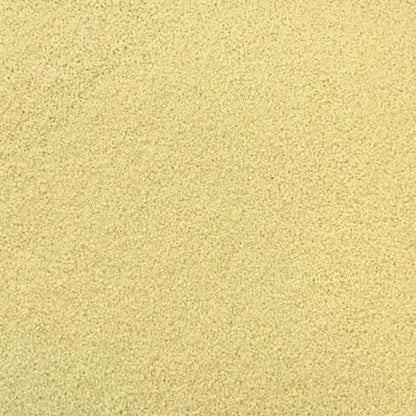 Raw organic white couscous from Whole Food Earth, GMO-free, vegan, and additive-free in a close-up image.