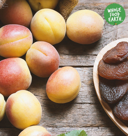Organic Whole Food Earth dried apricots, pitted and whole, showcasing their orange color and natural texture.
