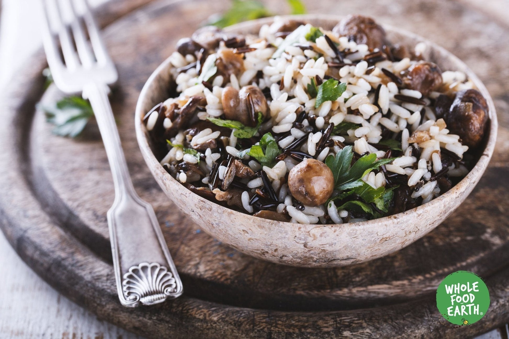 Raw organic wild rice from Whole Food Earth, showcasing long, dark grains in a natural, uncooked state for healthy vegan cooking
