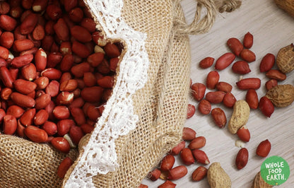 Whole Food Earth Pale Skin Peanuts in a bowl, natural, GMO-free, vegan nuts and seeds snack with no added sugar.