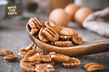 Raw Whole Food Earth Pecan Halves, GMO-free nuts and seeds, showcasing golden-brown pecan halves on a neutral background.