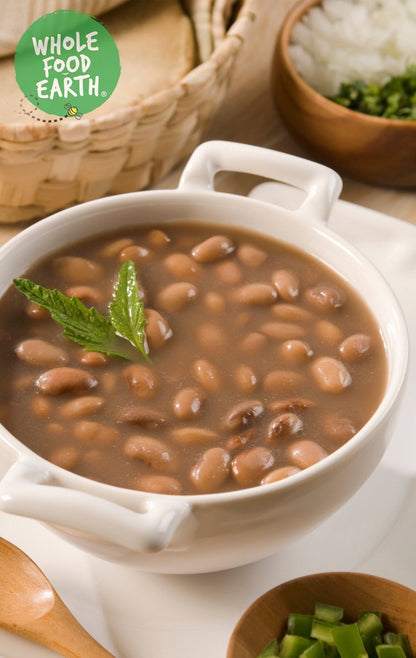 Whole Food Earth pinto beans in a bowl, showcasing natural, GMO-free, vegan, dairy-free pulses with a fresh appearance.
