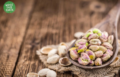 Raw pistachio kernels from Whole Food Earth, natural and GMO-free nuts ideal for vegan, dairy-free, and healthy snacking.