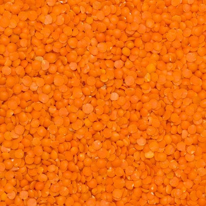 Red split lentils from Whole Food Earth, natural vegan beans and pulses, GMO-free and dairy-free, shown in a close-up image.